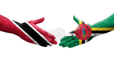 Téléchargez les photos : Poignée de main entre les drapeaux Dominique et Trinité Tobago peints sur les mains, image transparente isolée. - en image libre de droit