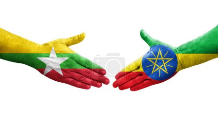 Foto de Apretón de manos entre Etiopía y Myanmar banderas pintadas en las manos, imagen transparente aislada. - Imagen libre de derechos