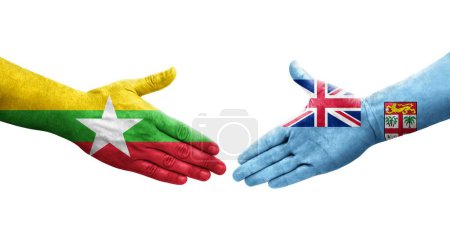 Foto de Apretón de manos entre las banderas de Fiji y Myanmar pintadas en las manos, imagen transparente aislada. - Imagen libre de derechos