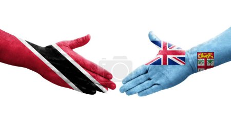 Téléchargez les photos : Poignée de main entre Fidji et Trinité Tobago drapeaux peints sur les mains, image transparente isolée. - en image libre de droit