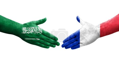Photo for Handshake between France and Saudi Arabia flags painted on hands, isolated transparent image. - Royalty Free Image