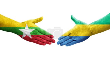 Foto de Apretón de manos entre Gabón y Myanmar banderas pintadas en las manos, imagen transparente aislada. - Imagen libre de derechos