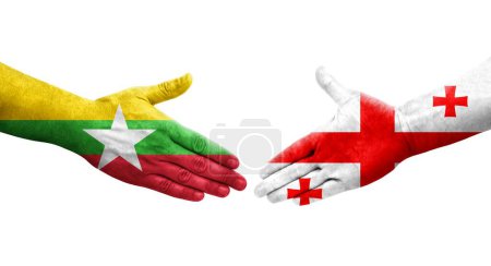 Foto de Apretón de manos entre Georgia y Myanmar banderas pintadas en las manos, imagen transparente aislada. - Imagen libre de derechos