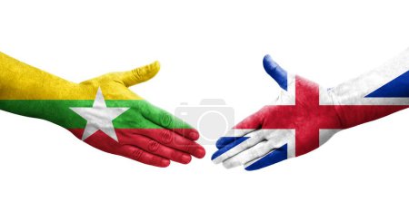 Foto de Apretón de manos entre Gran Bretaña y Myanmar banderas pintadas en las manos, imagen transparente aislada. - Imagen libre de derechos
