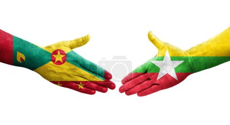 Foto de Apretón de manos entre las banderas de Granada y Myanmar pintadas en las manos, imagen transparente aislada. - Imagen libre de derechos