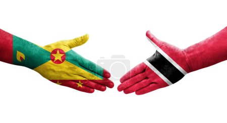 Téléchargez les photos : Poignée de main entre Grenade et Trinité Tobago drapeaux peints sur les mains, image transparente isolée. - en image libre de droit