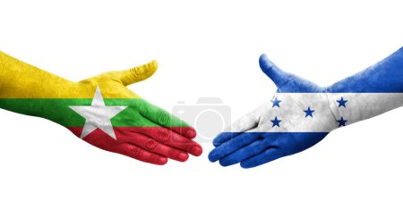 Foto de Mano apretada entre banderas de Honduras y Myanmar pintadas en las manos, imagen transparente aislada. - Imagen libre de derechos