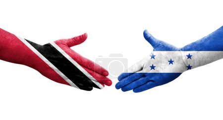 Téléchargez les photos : Poignée de main entre le Honduras et Trinité Tobago drapeaux peints sur les mains, image transparente isolée. - en image libre de droit