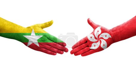 Foto de Apretón de manos entre Hong Kong y Myanmar banderas pintadas en las manos, imagen transparente aislada. - Imagen libre de derechos
