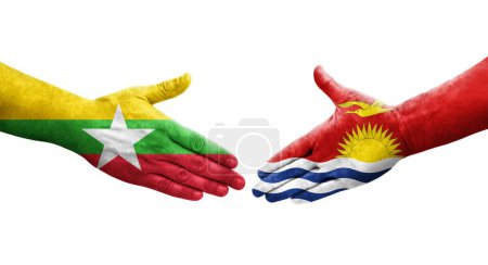 Foto de Apretón de manos entre Kiribati y Myanmar banderas pintadas en las manos, imagen transparente aislada. - Imagen libre de derechos