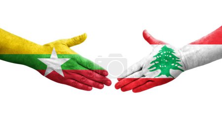 Foto de Apretón de manos entre Líbano y Myanmar banderas pintadas en las manos, imagen transparente aislada. - Imagen libre de derechos