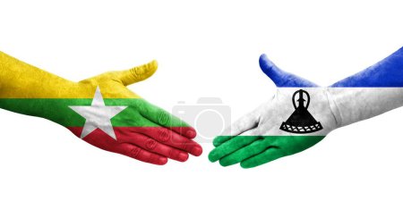 Foto de Apretón de manos entre Lesotho y Myanmar banderas pintadas en las manos, imagen transparente aislada. - Imagen libre de derechos
