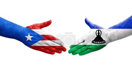 Foto de Saludo entre las banderas de Lesotho y Puerto Rico pintadas en las manos, imagen transparente aislada. - Imagen libre de derechos