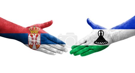 Foto de Apretón de manos entre Lesotho y Serbia banderas pintadas en las manos, imagen transparente aislada. - Imagen libre de derechos
