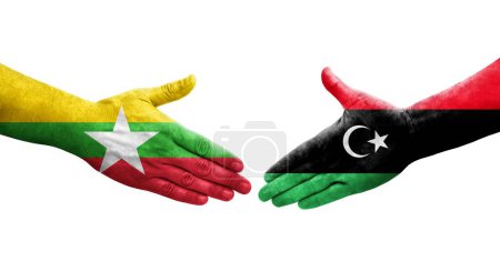 Foto de Apretón de manos entre Libia y Myanmar banderas pintadas en las manos, imagen transparente aislada. - Imagen libre de derechos
