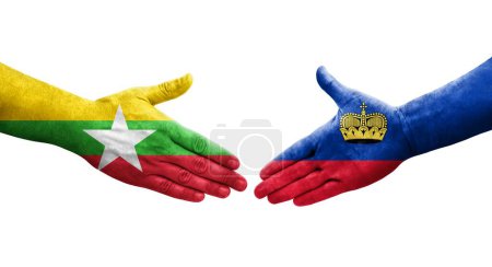 Foto de Apretón de manos entre Liechtenstein y Myanmar banderas pintadas en las manos, imagen transparente aislada. - Imagen libre de derechos