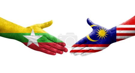 Foto de Apretón de manos entre Malasia y Myanmar banderas pintadas en las manos, imagen transparente aislada. - Imagen libre de derechos