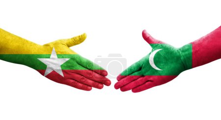 Foto de Apretón de manos entre Maldivas y Myanmar banderas pintadas en las manos, imagen transparente aislada. - Imagen libre de derechos