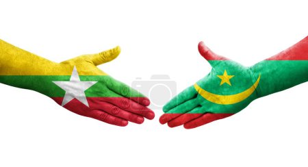 Foto de Apretón de manos entre Mauritania y Myanmar banderas pintadas en las manos, imagen transparente aislada. - Imagen libre de derechos