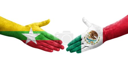 Foto de Apretón de manos entre México y Myanmar banderas pintadas en las manos, imagen transparente aislada. - Imagen libre de derechos