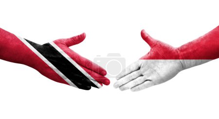 Téléchargez les photos : Poignée de main entre Monaco et Trinité Tobago drapeaux peints sur les mains, image transparente isolée. - en image libre de droit