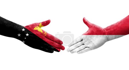 Téléchargez les photos : Poignée de main entre Monaco et la Papouasie-Nouvelle Guinée drapeaux peints sur les mains, image transparente isolée. - en image libre de droit