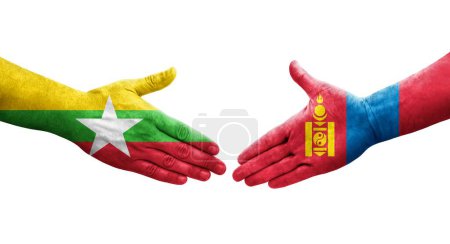 Foto de Apretón de manos entre Mongolia y Myanmar banderas pintadas en las manos, imagen transparente aislada. - Imagen libre de derechos