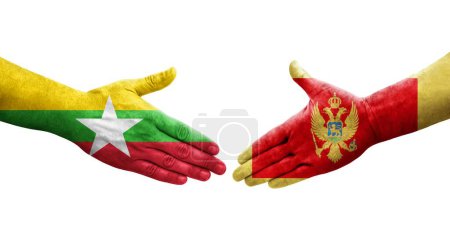 Foto de Apretón de manos entre Montenegro y Myanmar banderas pintadas en las manos, imagen transparente aislada. - Imagen libre de derechos