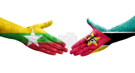 Foto de Apretón de manos entre Mozambique y Myanmar banderas pintadas en las manos, imagen transparente aislada. - Imagen libre de derechos