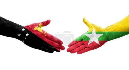 Foto de Apretón de manos entre Myanmar y Papúa Nueva Guinea banderas pintadas en las manos, imagen transparente aislada. - Imagen libre de derechos