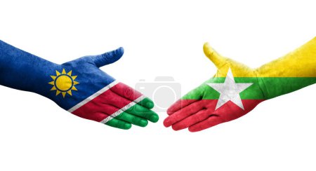 Foto de Apretón de manos entre Myanmar y Namibia banderas pintadas en las manos, imagen transparente aislada. - Imagen libre de derechos
