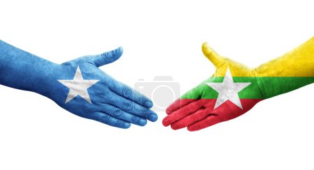 Foto de Apretón de manos entre Myanmar y Somalia banderas pintadas en las manos, imagen transparente aislada. - Imagen libre de derechos