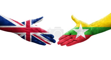 Foto de Apretón de manos entre Myanmar y Reino Unido banderas pintadas en las manos, imagen transparente aislada. - Imagen libre de derechos