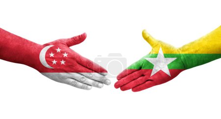 Foto de Apretón de manos entre Myanmar y Singapur banderas pintadas en las manos, imagen transparente aislada. - Imagen libre de derechos