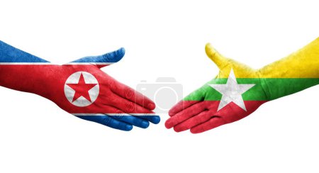 Foto de Apretón de manos entre Myanmar y Corea del Norte banderas pintadas en las manos, imagen transparente aislada. - Imagen libre de derechos