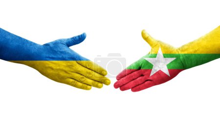 Foto de Apretón de manos entre Myanmar y Ucrania banderas pintadas en las manos, imagen transparente aislada. - Imagen libre de derechos