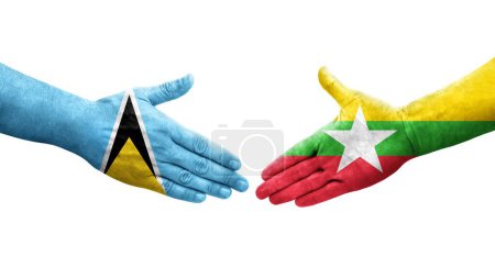 Foto de Apretón de manos entre Myanmar y Santa Lucía banderas pintadas en las manos, imagen transparente aislada. - Imagen libre de derechos
