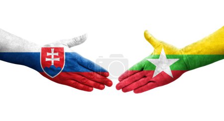 Foto de Apretón de manos entre Myanmar y Eslovaquia banderas pintadas en las manos, imagen transparente aislada. - Imagen libre de derechos