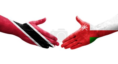 Téléchargez les photos : Poignée de main entre Oman et Trinidad Tobago drapeaux peints sur les mains, image transparente isolée. - en image libre de droit