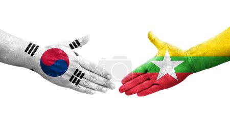 Foto de Apretón de manos entre Corea del Sur y Myanmar banderas pintadas en las manos, imagen transparente aislada. - Imagen libre de derechos