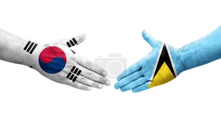 Photo for Handshake between South Korea and Saint Lucia flags painted on hands, isolated transparent image. - Royalty Free Image