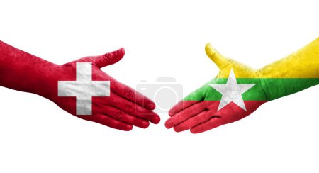 Foto de Apretón de manos entre Suiza y Myanmar banderas pintadas en las manos, imagen transparente aislada. - Imagen libre de derechos