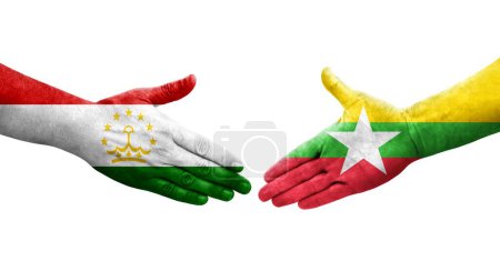 Foto de Apretón de manos entre Tayikistán y Myanmar banderas pintadas en las manos, imagen transparente aislada. - Imagen libre de derechos