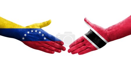 Téléchargez les photos : Poignée de main entre Trinité Tobago et Venezuela drapeaux peints sur les mains, image transparente isolée. - en image libre de droit