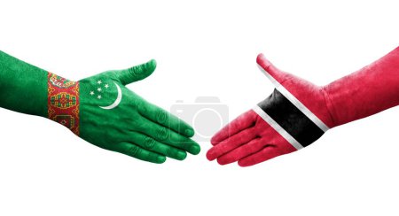 Téléchargez les photos : Poignée de main entre Trinité Tobago et Turkménistan drapeaux peints sur les mains, image transparente isolée. - en image libre de droit