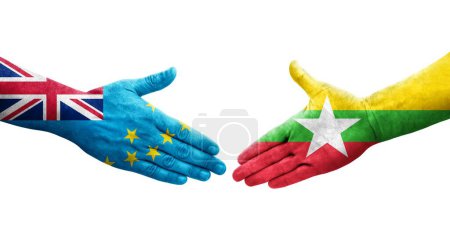 Foto de Apretón de manos entre Tuvalu y Myanmar banderas pintadas en las manos, imagen transparente aislada. - Imagen libre de derechos