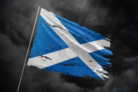 Scotland torn flag on dark sky background.