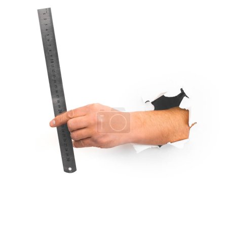 Photo for Stainless steel Ruler in hand on White background - Royalty Free Image