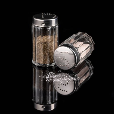 Photo for Salt and pepper shaker isolated on black background - Royalty Free Image