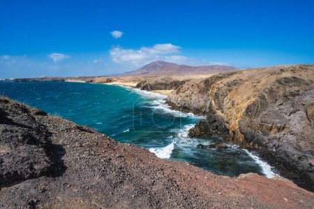 View of the Atlantic Ocean with its rocky cliffs and the beautiful Papagayo beaches on the Canary Island of Lanzarote in the Atlantic Ocean